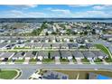 Community overview featuring numerous houses and a lake at 416 Mckenna Dr, Winter Haven, FL 33881