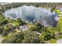 Aerial view showing the house, pool, and lakefront location at 4834 Hall Rd, Orlando, FL 32817