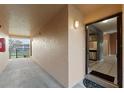 Apartment hallway with access to unit and fire extinguisher at 5208 Via Hacienda Cir # 201, Orlando, FL 32839