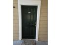 Dark green front door with white trim at 13103 Mulberry Park Dr # 817, Orlando, FL 32821