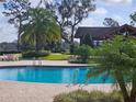 Community pool with a relaxing gazebo and lush landscaping at 33836 Venice Ln, Sorrento, FL 32776