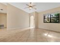 Spacious living room featuring tile floors and an open floor plan at 3629 Peaceful Pl, Orlando, FL 32810