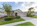 One-story house with a two-car garage and landscaping at 6920 Phillips Reserve Ct, Orlando, FL 32819