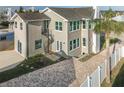 Rear view of two story home with spiral staircase at 727 N Grandview Ave, Daytona Beach, FL 32118