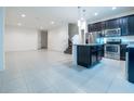 Modern kitchen with stainless steel appliances and island at 1166 Presidential Ln, Apopka, FL 32703