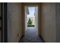 Brick walkway leading to backyard with view of other townhomes at 1166 Presidential Ln, Apopka, FL 32703