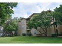 Tan three-story apartment building with balconies at 1341 Arbor Vista Loop # 213, Lake Mary, FL 32746