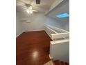 Spacious loft bedroom with wood flooring and a ceiling fan at 174 Waterfall Way # 106, Altamonte Springs, FL 32714