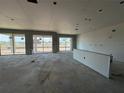 Unfinished main living space with drywall and multiple windows at 5385 Park Guell St, Saint Cloud, FL 34771