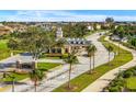 Gated community entrance with landscaped medians and palm trees at 7824 Whitemarsh Way, Reunion, FL 34747