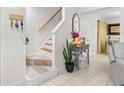 Staircase and entryway with decor and plants at 4522 Brook Hollow Cir, Winter Springs, FL 32708