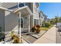Townhome entrance with landscaping and walkway at 4522 Brook Hollow Cir, Winter Springs, FL 32708