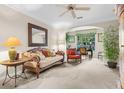 Living room with hardwood floors and lots of natural light at 12843 Madison Pointe Cir # 107, Orlando, FL 32821