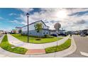 Two-story house with landscaped yard and street view at 2277 Derwent Dr, Davenport, FL 33896