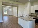 Open concept kitchen with island and granite countertops at 42 Argos Ave, Orlando, FL 32811