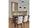 Modern dining room with dark wood table and seating for six at 6214 Stevenson Dr # 303, Orlando, FL 32835