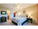 Bedroom with double bed, nightstands, and a walk-in closet at 1065 S Hiawassee Rd # 1428, Orlando, FL 32835