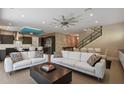 Bright living room with white sofas and large windows at 1429 Chapman Cir, Winter Park, FL 32789