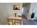 Small dining area with marble top table and gold chairs at 4400 Thornbriar Ln # 201, Orlando, FL 32822