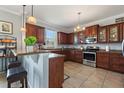 Spacious kitchen with stainless steel appliances and granite countertops at 2056 Marabou Dr, Davenport, FL 33896