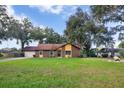 Ranch style home with a large front yard at 10150 Sw 73Rd Ter, Ocala, FL 34476