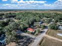 Aerial view showing home's location in a wooded area at 3250 Mountain Lake Cutoff Rd, Lake Wales, FL 33859