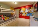 Mickey Mouse themed bedroom with bunk beds at 7400 Oakmoss Loop, Davenport, FL 33837
