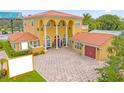 Luxury two-story home with tile roof and large driveway at 7440 Aloma Ave, Winter Park, FL 32792