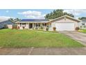 House exterior featuring solar panels and landscaping at 8626 Baylor Cir, Orlando, FL 32817