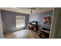 Spacious bedroom with large window and wood-look floors at 871 Lake Jackson Cir, Apopka, FL 32703