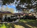 House exterior with walkway, landscaping, and a brown roof at 252 Shady Oaks Cir, Lake Mary, FL 32746