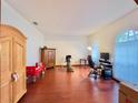 Home office features hardwood floors, built in wooden cabinet, and large window at 252 Shady Oaks Cir, Lake Mary, FL 32746