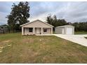 Single-story house with attached garage and large backyard at 9650 Nw Gainesville Rd, Ocala, FL 34475