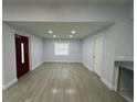 Bright living room with hardwood floors and recessed lighting at 1009 Herndon St, Leesburg, FL 34748