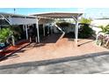 Mobile home with carport and landscaped area at 2025 St George Dr, Davenport, FL 33837