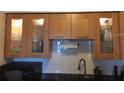 Bright kitchen boasts stylish wood cabinets and updated countertops at 616 Georgetown Dr # B, Casselberry, FL 32707