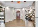 Elegant entryway with high ceilings and wood door at 2550 Venetian Way, Winter Park, FL 32789
