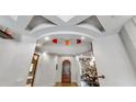 Dramatic entryway with a circular staircase and high ceilings at 2550 Venetian Way, Winter Park, FL 32789