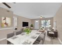 Open living and dining area with staged furniture at 725 Northlake Blvd # 45, Altamonte Springs, FL 32701