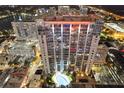 Nighttime aerial of highrise building, pool, and city lights at 155 S Court Ave # 2609, Orlando, FL 32801