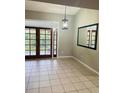Bright dining room with access to the patio at 218 Meadow Green Dr, Davenport, FL 33837