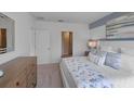 Spacious main bedroom with a king-size bed, dresser, and ensuite bathroom access at 4185 Singing Mockingbird Blvd, Bartow, FL 33830
