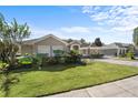 One-story house showcasing a manicured lawn and attractive curb appeal at 6807 Sylvan Woods Dr, Sanford, FL 32771