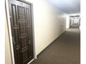 Building hallway with carpet and access to unit at 1415 Ocean Shore Blvd # B060, Ormond Beach, FL 32176