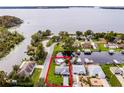 Aerial view of waterfront property with surrounding houses at 26603 W Cove Dr, Tavares, FL 32778