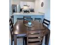 Modern kitchen with stainless steel appliances and breakfast bar at 310 Gardenia Ct, Poinciana, FL 34759