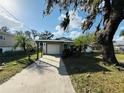 Landscaped yard with driveway leading to home at 4171 Radford Rd, Bartow, FL 33830