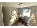 Bedroom with dresser and a high chair at 8 W Ella J Gilmore St, Apopka, FL 32703