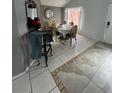 Dining room features a tiled floor and elegant furnishings at 8601 Knottingham Dr, Kissimmee, FL 34747