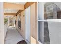Condo hallway with access to unit and balcony view at 2711 Emerald Lake Ct, Kissimmee, FL 34744